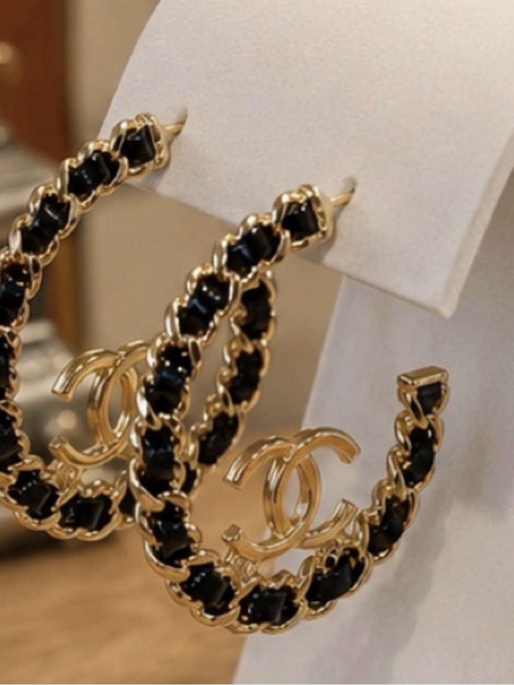 Gold-Tone Hoop Earrings with Black Accents and Interlocking Logo - Picture 2 of 3